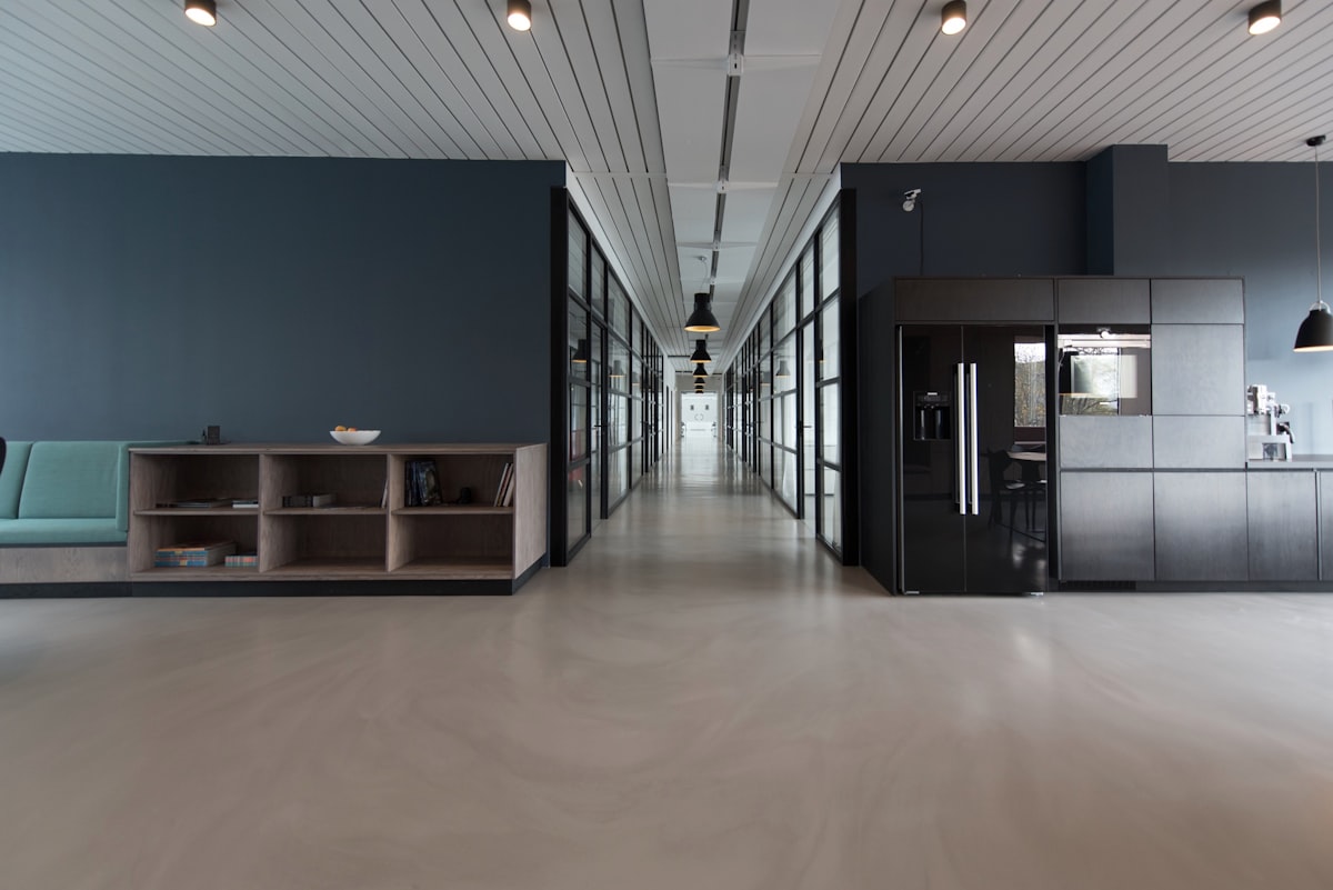 Modern office corridor with glass meeting rooms