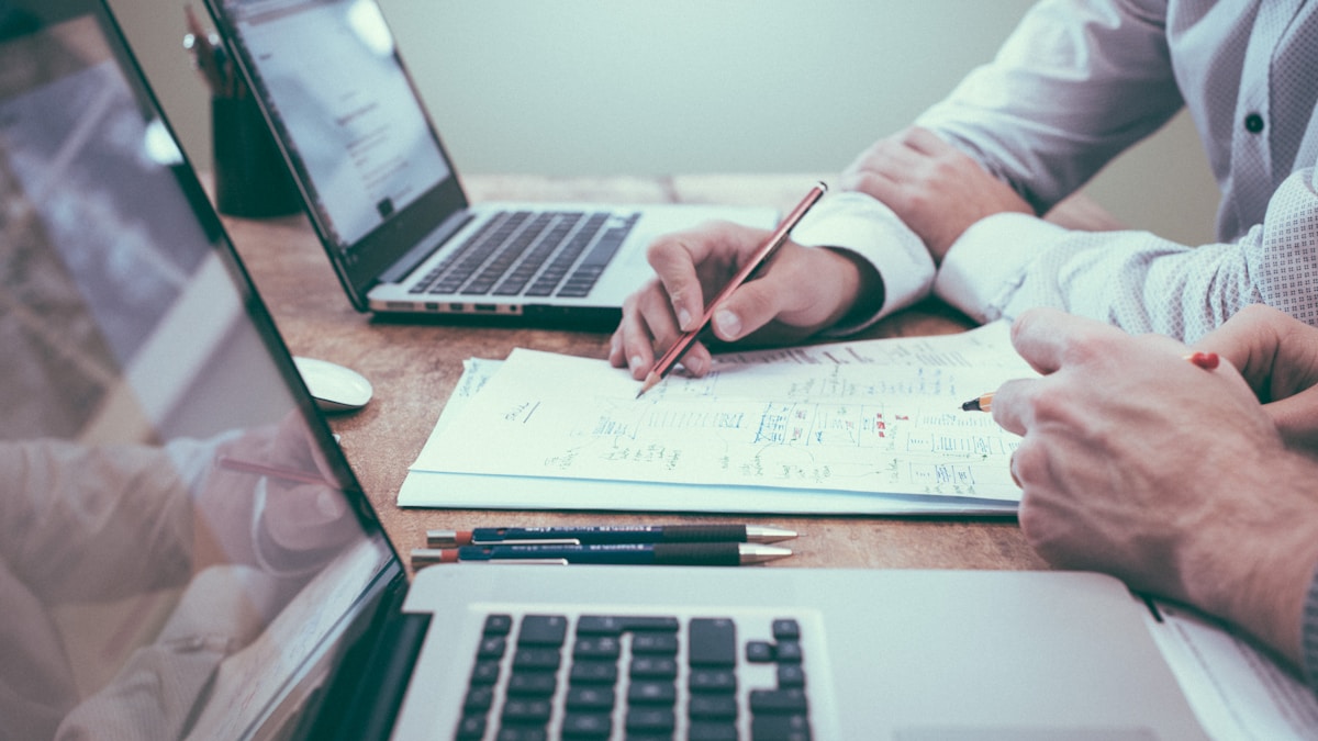 Documents and laptop on a meeting table